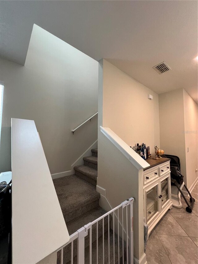 11097 N Folklore St, Winter Garden, FL 34787 - stairway with tile patterned floors and baseboards