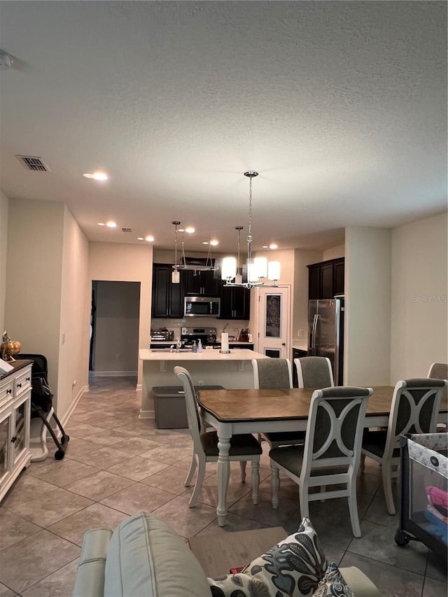 11097 N Folklore St, Winter Garden, FL 34787 - dining area featuring light tile patterned floors, recessed lighting, baseboards, and a chandelier