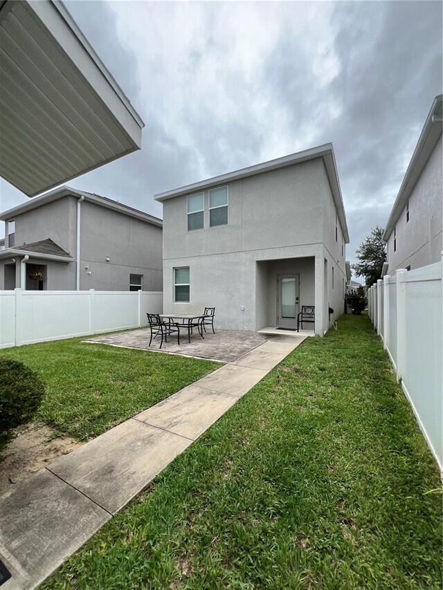 11097 N Folklore St, Winter Garden, FL 34787 - back of property with a patio area and stucco siding
