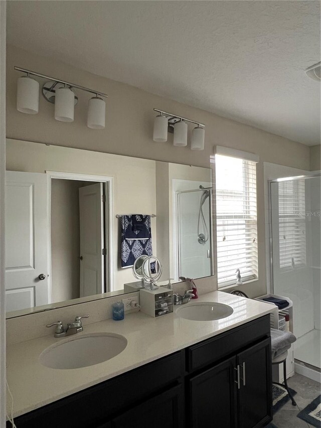 11097 N Folklore St, Winter Garden, FL 34787 - bathroom featuring a stall shower and double vanity