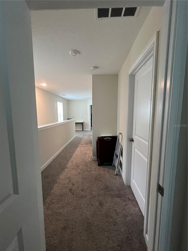 11097 N Folklore St, Winter Garden, FL 34787 - hallway featuring carpet, baseboards, a textured ceiling, and recessed lighting
