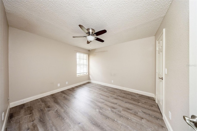 420 Forestway Cir Unit 306, Altamonte Springs, FL 32701 - spare room with a ceiling fan, wood finished floors, a textured ceiling, and baseboards