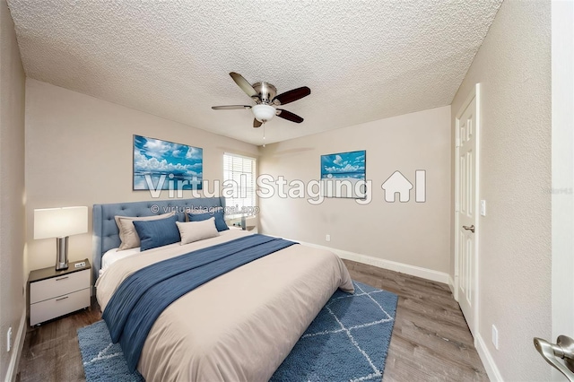 420 Forestway Cir Unit 306, Altamonte Springs, FL 32701 - bedroom featuring wood finished floors, ceiling fan, baseboards, and a textured ceiling