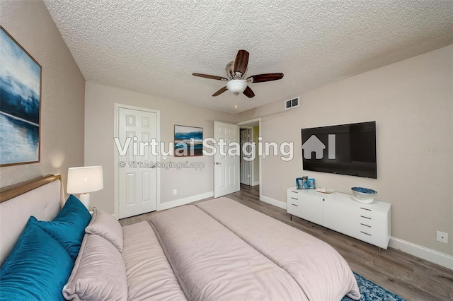 420 Forestway Cir Unit 306, Altamonte Springs, FL 32701 - bedroom with wood finished floors, baseboards, a textured ceiling, and ceiling fan