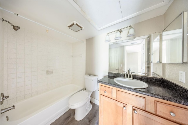 420 Forestway Cir Unit 306, Altamonte Springs, FL 32701 - bathroom featuring wood finished floors, toilet, vanity, and bathtub / shower combination