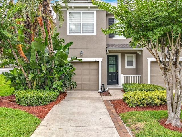 2005 Compass Flower Way, Ocoee, FL 34761 - view of front of home with stucco siding and concrete driveway