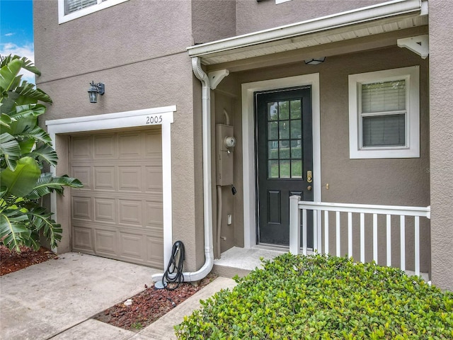 2005 Compass Flower Way, Ocoee, FL 34761 - doorway to property with stucco siding and concrete driveway
