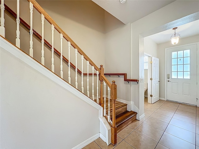 2005 Compass Flower Way, Ocoee, FL 34761 - foyer entrance with baseboards, light tile patterned flooring, and stairs
