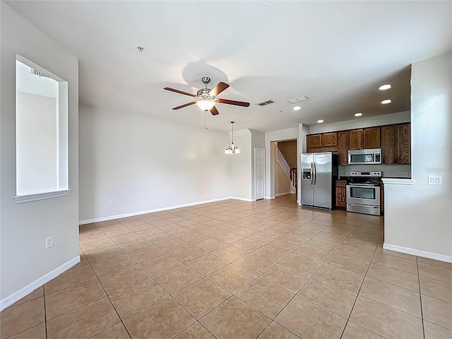2005 Compass Flower Way, Ocoee, FL 34761 - kitchen with stainless steel appliances, light tile patterned floors, a ceiling fan, recessed lighting, and dark brown cabinets