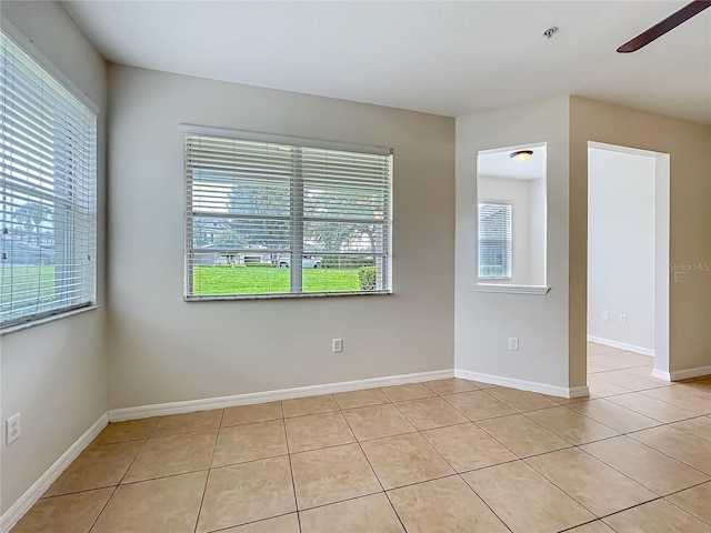 2005 Compass Flower Way, Ocoee, FL 34761 - unfurnished room with healthy amount of natural light, light tile patterned floors, a ceiling fan, and fire sprinkler in ceiling