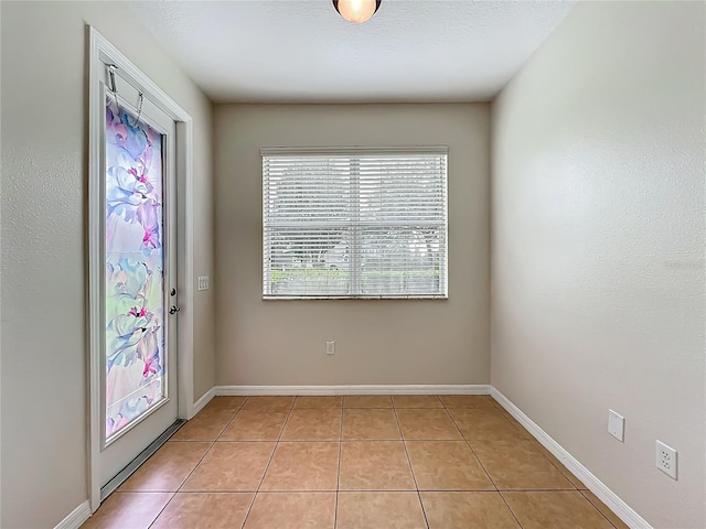 2005 Compass Flower Way, Ocoee, FL 34761 - entryway with light tile patterned floors and baseboards