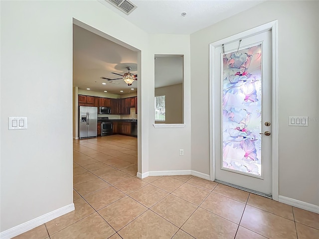 2005 Compass Flower Way, Ocoee, FL 34761 - foyer with light tile patterned floors, ceiling fan, recessed lighting, and baseboards