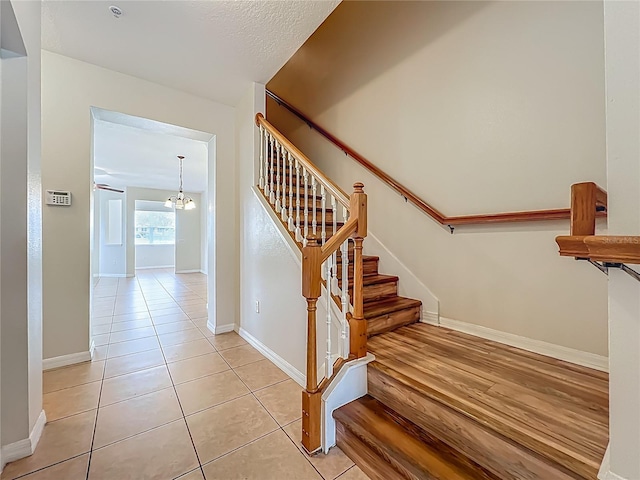 2005 Compass Flower Way, Ocoee, FL 34761 - stairway featuring a chandelier, baseboards, and tile patterned floors