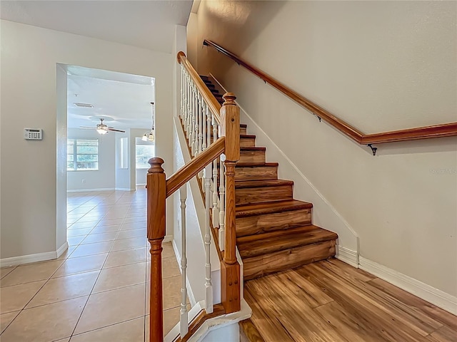 2005 Compass Flower Way, Ocoee, FL 34761 - stairway with baseboards, ceiling fan, and tile patterned floors