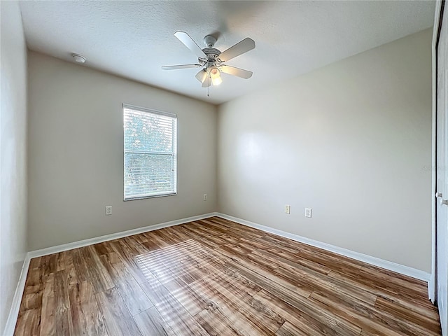 2005 Compass Flower Way, Ocoee, FL 34761 - spare room with wood finished floors, ceiling fan, and baseboards