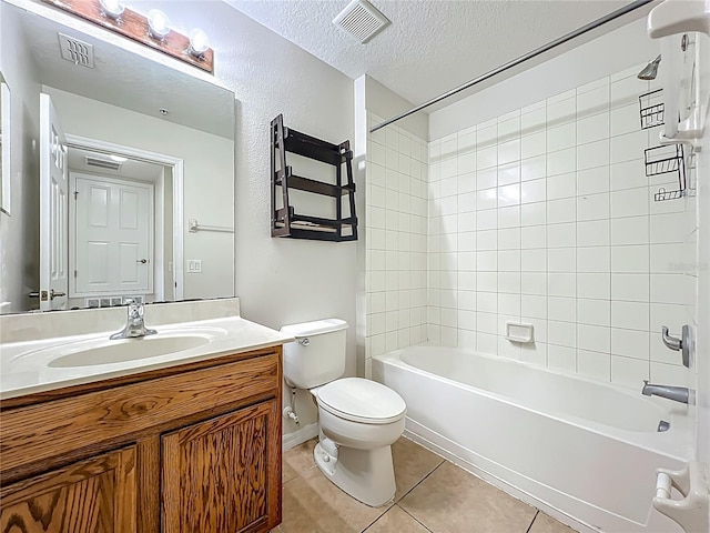 2005 Compass Flower Way, Ocoee, FL 34761 - bathroom featuring vanity, tile patterned floors, toilet, bathing tub / shower combination, and a textured ceiling