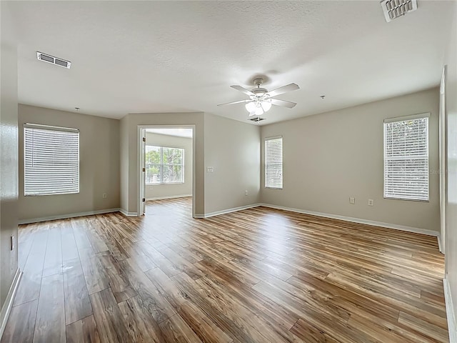 2005 Compass Flower Way, Ocoee, FL 34761 - empty room featuring ceiling fan, wood finished floors, and baseboards