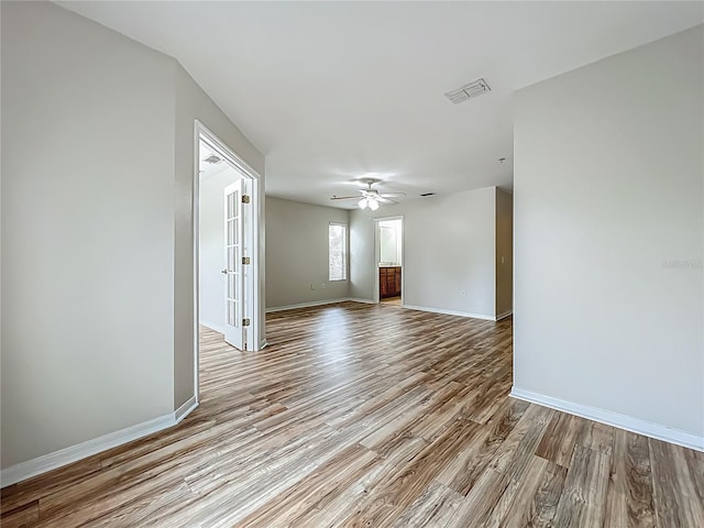 2005 Compass Flower Way, Ocoee, FL 34761 - unfurnished room with wood finished floors, ceiling fan, and baseboards