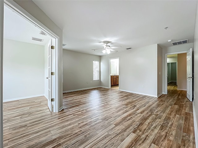 2005 Compass Flower Way, Ocoee, FL 34761 - spare room with wood finished floors, a ceiling fan, and baseboards