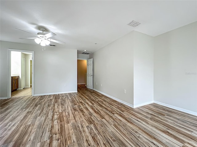 2005 Compass Flower Way, Ocoee, FL 34761 - empty room with wood finished floors, a ceiling fan, and baseboards