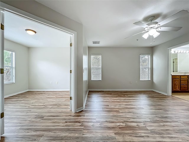 2005 Compass Flower Way, Ocoee, FL 34761 - spare room with wood finished floors, ceiling fan, and baseboards