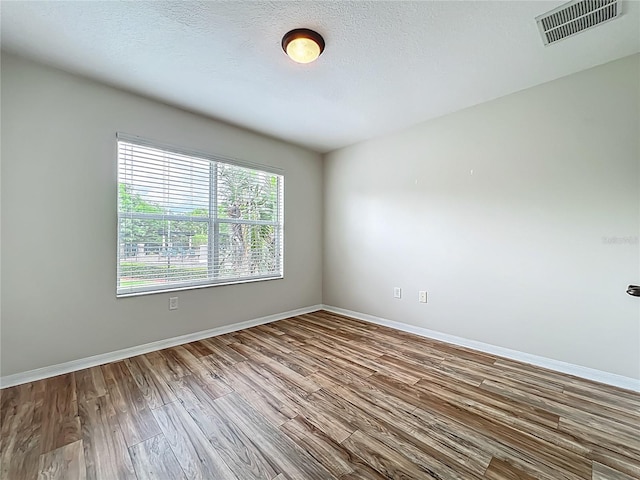 2005 Compass Flower Way, Ocoee, FL 34761 - empty room with wood finished floors and baseboards