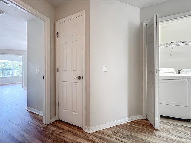 2005 Compass Flower Way, Ocoee, FL 34761 - corridor with wood finished floors, independent washer and dryer, and baseboards