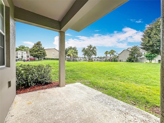 2005 Compass Flower Way, Ocoee, FL 34761 - view of green lawn with a patio and a residential view