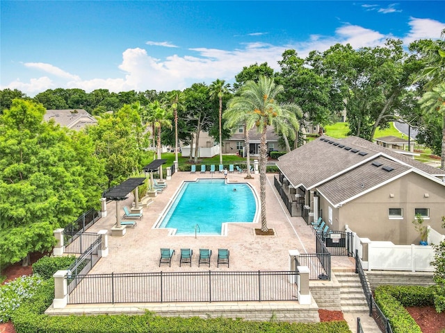 2005 Compass Flower Way, Ocoee, FL 34761 - community pool with a patio area and view of scattered trees