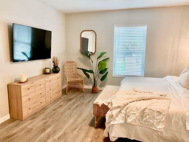 4865 S Tromp Loop, Homosassa, FL 34448 - bedroom with light wood-style floors and baseboards