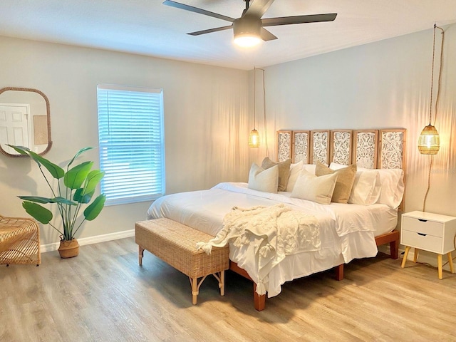 4865 S Tromp Loop, Homosassa, FL 34448 - bedroom with wood finished floors, baseboards, and a ceiling fan