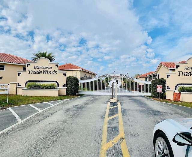 4865 S Tromp Loop, Homosassa, FL 34448 - view of asphalt street featuring a gate and a gated entry