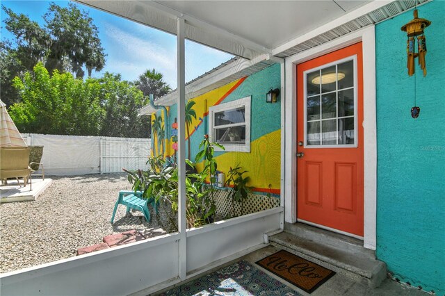 318 Palm St, New Smyrna Beach, FL 32168 - property entrance featuring stucco siding