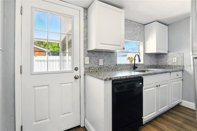 318 Palm St, New Smyrna Beach, FL 32168 - kitchen with black dishwasher, backsplash, a sink, light stone countertops, and white cabinets