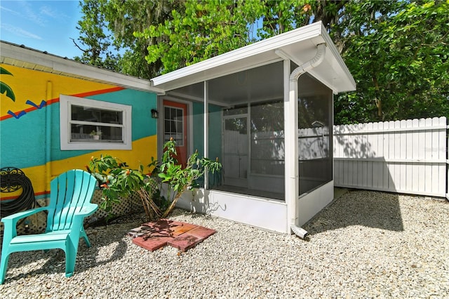 318 Palm St, New Smyrna Beach, FL 32168 - back of house with a sunroom