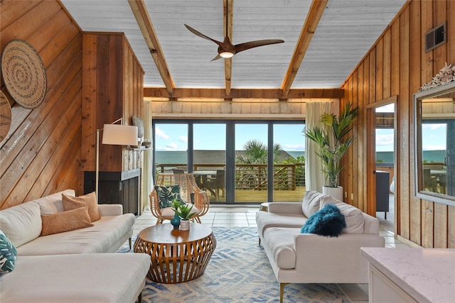 4365 S Atlantic Ave Unit B8, New Smyrna Beach, FL 32169 - living area with wooden walls and ceiling fan