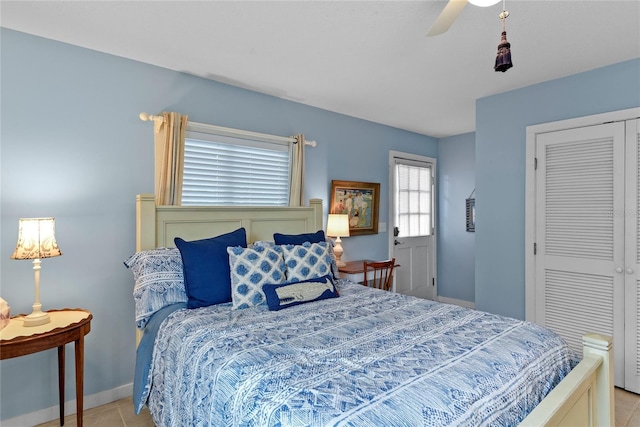 4365 S Atlantic Ave Unit B8, New Smyrna Beach, FL 32169 - bedroom with a ceiling fan, baseboards, a closet, and light tile patterned flooring