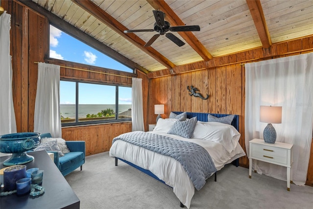 4365 S Atlantic Ave Unit B8, New Smyrna Beach, FL 32169 - bedroom featuring wood walls, wooden ceiling, a water view, light colored carpet, and ceiling fan