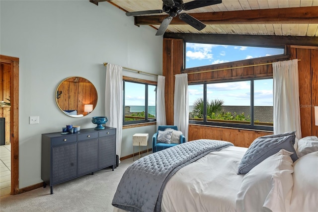 4365 S Atlantic Ave Unit B8, New Smyrna Beach, FL 32169 - bedroom featuring light carpet, wood ceiling with exposed beams, high vaulted ceiling, and baseboards
