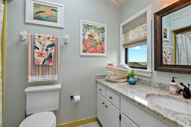 4365 S Atlantic Ave Unit B8, New Smyrna Beach, FL 32169 - full bathroom with vanity, toilet, curtained shower, and baseboards