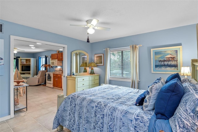 4365 S Atlantic Ave Unit B8, New Smyrna Beach, FL 32169 - bedroom featuring ceiling fan and light tile patterned flooring