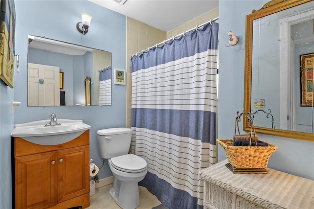 4365 S Atlantic Ave Unit B8, New Smyrna Beach, FL 32169 - bathroom featuring toilet, vanity, tile patterned floors, and a shower with curtain