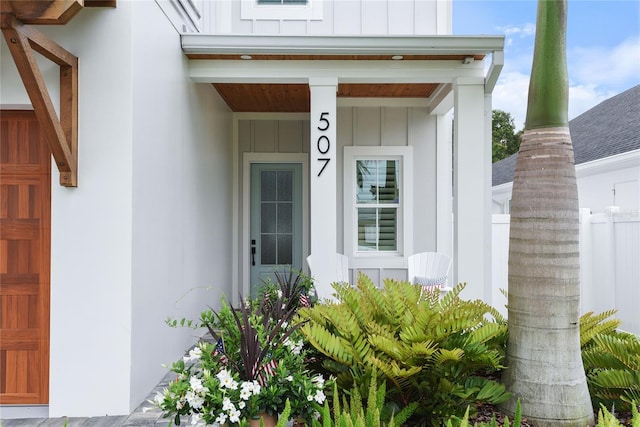507 S Pine St, New Smyrna Beach, FL 32169 - property entrance featuring board and batten siding and covered porch