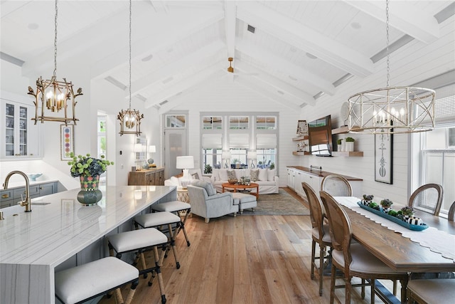 507 S Pine St, New Smyrna Beach, FL 32169 - dining area with a chandelier and light wood finished floors