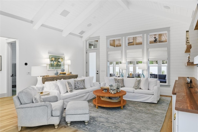 507 S Pine St, New Smyrna Beach, FL 32169 - living area with light wood-style flooring, beam ceiling, and high vaulted ceiling