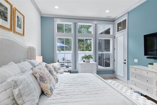 507 S Pine St, New Smyrna Beach, FL 32169 - bedroom featuring wood finished floors, recessed lighting, and crown molding