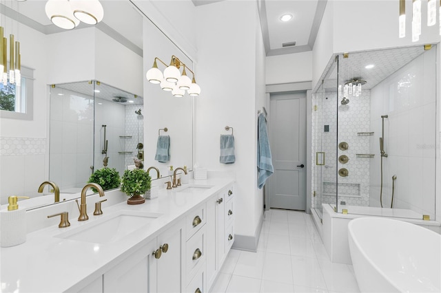 507 S Pine St, New Smyrna Beach, FL 32169 - full bath featuring a stall shower, a soaking tub, double vanity, recessed lighting, and tile patterned floors