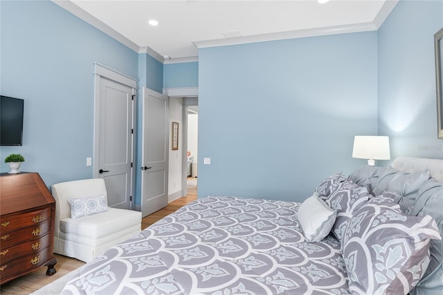507 S Pine St, New Smyrna Beach, FL 32169 - bedroom featuring wood finished floors, ornamental molding, and recessed lighting