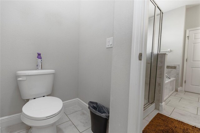 1431 Leitrim Loop, Apopka, FL 32703 - full bathroom with toilet, a garden tub, a shower stall, and baseboards
