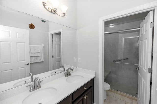 1431 Leitrim Loop, Apopka, FL 32703 - full bathroom featuring double vanity, toilet, a shower stall, and tile patterned flooring